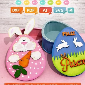 May include: Pink and blue Easter egg-shaped boxes with bunny and carrot details. The image includes the text "Easter Boxes" and "Digital File" with DXF, PDF, AI, and SVG file type icons. The boxes are for Easter.