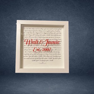 May include: A framed print with a white border. The print features a poem with the names "Walt & Jamie" in red script, and the text "Est. 2007". The background is a cream color, and the frame is square.