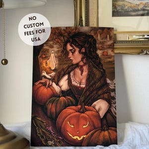 May include: A rectangular art print featuring a dark-haired individual in a plaid shawl surrounded by pumpkins in a forest setting. One carved jack-o'-lantern glows orange, while a small white ghost holding a lantern floats in the background.