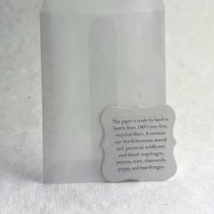 May include: A white envelope made from 100% tree-free recycled fibers. The envelope is made by hand in Seattle and contains a wildflower seed blend: snapdragon, petunia, mint, chamomile, poppy, and beardtongue.