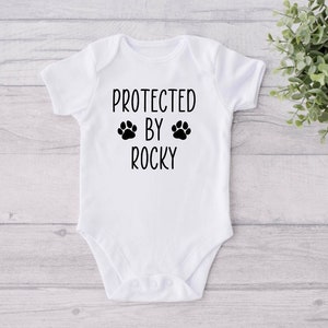 Personalized Dog Name Baby Bodysuit, Custom Dog Name Bodysuit, Protected By Dog Bodysuit, Pregnancy Reveal Bodysuit, Siblings have paws