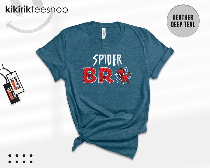 May include: A heather deep teal short-sleeve t-shirt featuring the white text SPIDER above the red text BRO, with a small red and blue spider-themed character graphic and a white spiderweb design integrated into the letter O.