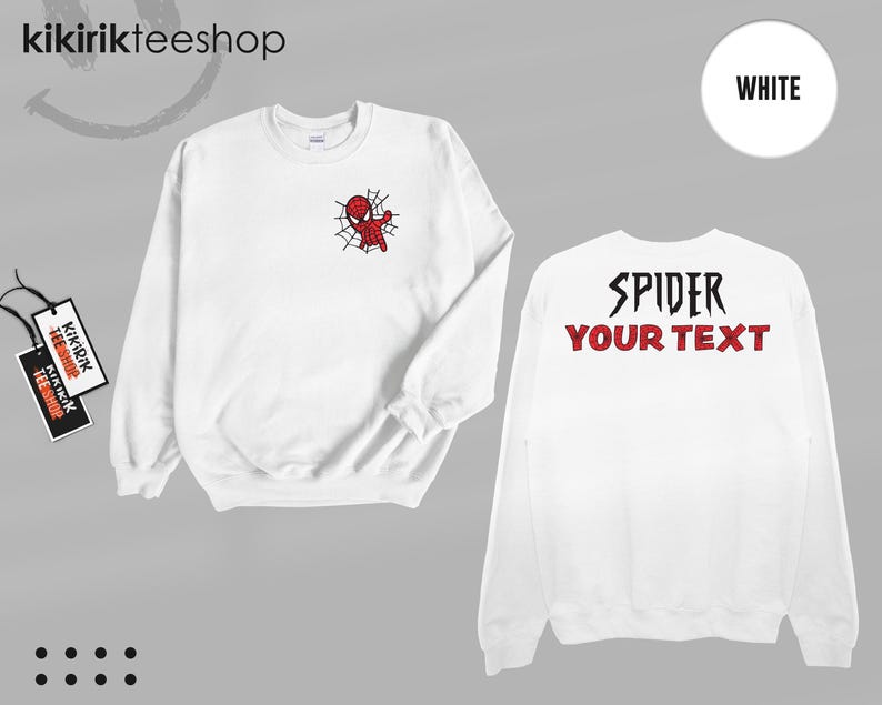 May include: A white long-sleeve sweatshirt featuring a small red and black spider character graphic on the left chest. The back of the sweatshirt displays the black text SPIDER and the red text YOUR TEXT. The garment includes two branded tags.