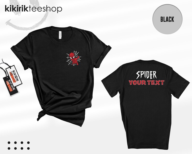 May include: A black short-sleeve t-shirt featuring a small red and black spider-themed character graphic on the left chest. The back of the shirt displays the white text SPIDER above the red text YOUR TEXT in a stylized, jagged font.