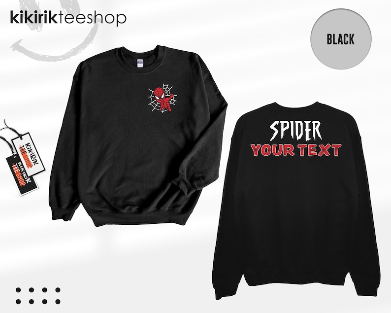May include: A black long-sleeve sweatshirt featuring a small red and white spider-themed graphic on the left chest. The back of the sweatshirt displays the white text SPIDER above the red text YOUR TEXT in a stylized font. Includes brand tags.