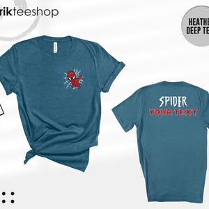 May include: A heather deep teal short-sleeve t-shirt featuring a small Spider-Man graphic on the left chest. The back of the shirt displays the text SPIDER in white and YOUR TEXT in red. The shirt is shown from both front and back views.