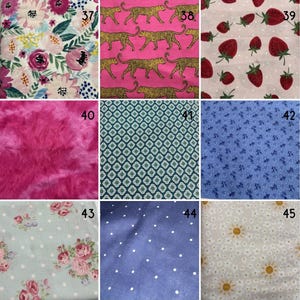 May include: A grid of nine fabric swatches labelled 37 through 45. Patterns include floral prints, cheetahs on pink, strawberries on white, hot pink faux fur, geometric shapes, blue floral, roses on polka dots, blue polka dots, and daisies with suns.