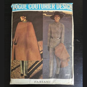 May include: Vintage Vogue Couturier Design sewing pattern featuring a cape and suit design. The cover shows two women modeling the designs. The text "VOGUE COUTURIER DESIGN" is at the top, with "FABIANI" at the bottom, and the pattern number "2591".
