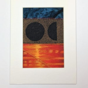 May include: A framed abstract art piece with a blue, brown, and orange color scheme. The artwork features two circles, one whole and one half, on a brown background. The piece is ready to frame and measures 7 inches by 5 inches.