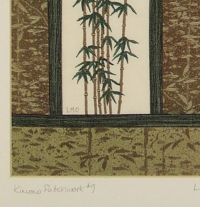 May include: A framed print of a green bamboo plant with a brown background. The print is titled "Kimono Patchwork #9" and signed "LMO".