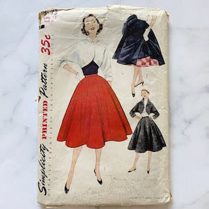 May include: Vintage Simplicity sewing pattern for a skirt and a jacket. The pattern is for size 13, bust 31, and costs 35 cents. The pattern shows a woman wearing a red skirt and a white jacket, and another woman wearing a black skirt and a black jacket.
