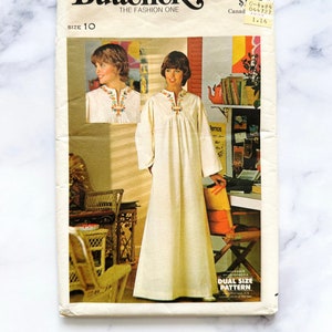 May include: Vintage sewing pattern envelope for a white nightgown with embroidery. The pattern is for size 10 and is from Butterick, The Fashion One. The pattern number is 4560.