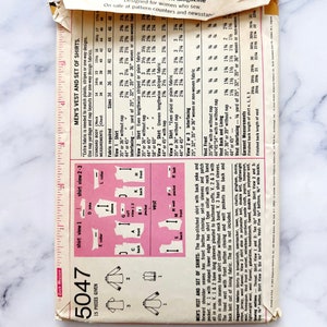 May include: A vintage sewing pattern for a men's vest and set of shirts. The pattern is for size 42, with a chest measurement of 107 cm. The pattern includes instructions and diagrams for sewing the garments.