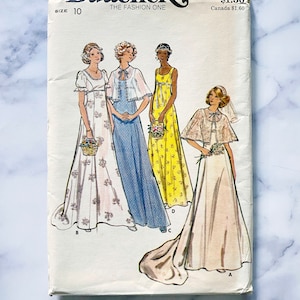 May include: A vintage sewing pattern for four different styles of wedding dresses. The pattern is from Butterick, size 10, and is for pattern number 4297. The dresses are all long and flowy, with different necklines and sleeves. The pattern includes instructions for making a cape, a veil, and a bouquet.