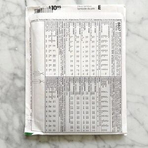 May include: A sewing pattern for a jumpsuit or a dress with a combination of fabrics. The pattern includes instructions for sizes 4-16. The pattern is printed in black and white on a white background. The pattern is titled "Chasuble and Jumpsuit for Young Women" and the pattern number is 8837.