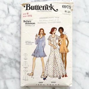 May include: Vintage Butterick sewing pattern featuring designs by Betsey Johnson of Alley Cat. The pattern includes illustrations of three dresses and the text "Butterick The Fashion One". Size 8, bust 31 1/2 inches.