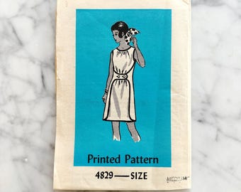 Printed Pattern 4829 – Size Medium 34-36 Bust. Anne Adams 1960s sleeveless wrap front shift dress. Mod vintage sewing pattern.