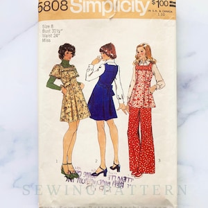 May include: Vintage Simplicity sewing pattern 5808. The pattern features illustrations of three different outfits: a floral dress, a blue jumper, and a red polka-dot jumpsuit. The pattern includes measurements for a size 8, with a bust of 31.5 inches and a waist of 24 inches.