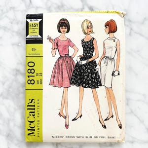 May include: Vintage McCall's sewing pattern for misses' dresses with slim or full skirts. The pattern features illustrations of three dresses. The pattern is size 18, bust 38. The cover is yellow and white with the text "EASY" and "McCall's".