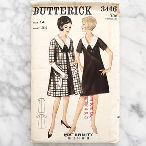 May include: Vintage sewing pattern envelope for a maternity dress. The pattern is from Butterick and is number 3446. The envelope shows a black and white checkered dress and a black dress with a white collar. The pattern is for sizes 10-18.