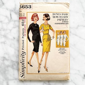 May include: Simplicity sewing pattern number 5653 for a dress. The pattern includes instructions for a basic "how-to-sew" pattern in misses' proportioned sizes. The pattern is printed on a white background with a yellow and black illustration of two women wearing dresses.