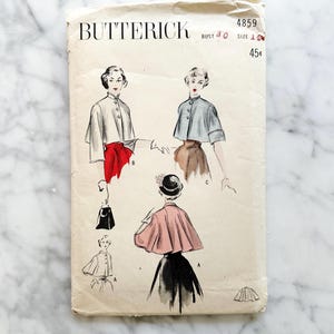 May include: Vintage Butterick sewing pattern featuring illustrations of women's capes and jackets. The pattern includes a bust size of 30 inches and a size 12. The cover is aged with visible wear and tear, showcasing a retro aesthetic.