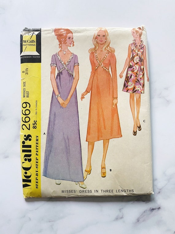 McCalls 2669  Bust 31.5. 70s empire waist dress in three lengths. Trim  detail evening or daywear. Vintage sewing pattern.