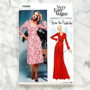 May include: Vintage sewing pattern for a wrap dress by Diane Von Furstenberg. The pattern is for sizes UK 12-14-16-18-20. The pattern shows a red and white printed wrap dress and a solid red wrap dress.