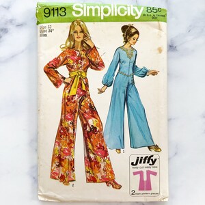 May include: Vintage Simplicity sewing pattern number 9113 for a jumpsuit. The pattern is for size 12, bust 34 inches, and is for misses. The pattern shows two different styles of jumpsuits, one with a floral print and one in a solid blue colour. The pattern is labelled "Jiffy easy cut-easy sew" and has two main pattern pieces.