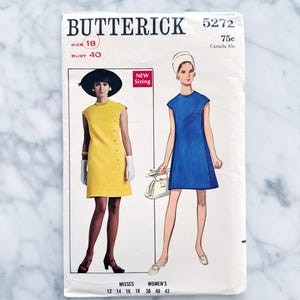 May include: Vintage sewing pattern for a sleeveless dress, Butterick pattern number 5272, size 18, bust 40. The pattern features two models wearing the dress in yellow and blue. The pattern is labeled "New Sizing" and includes sizes 12-18 for misses and 38-42 for women's.