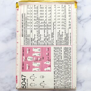 May include: A vintage sewing pattern for a vest and set of shirts. The pattern is labelled "5047" and includes 15 pieces. The pattern includes instructions for making a vest and three different styles of shirts. The pattern includes a chart with fabric requirements and measurements for different sizes.