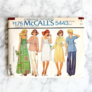 May include: Vintage McCall's 5443 sewing pattern showing five dress and top designs. The pattern envelope features illustrations of the finished garments, with a bust size of 80 cm.