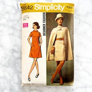 May include: Vintage Simplicity sewing pattern number 3642 for a dress with a cape. The pattern is for size 10, bust 32 1/2, and is for misses. The pattern is for designer fashion and includes a bonus design touch leaflet.