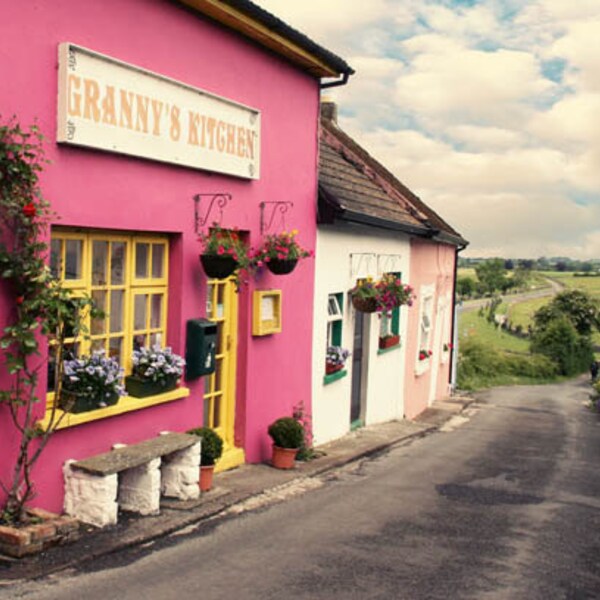 Ireland Photography - Cashel pink building Granny's Kitchen small town road side green landscape tourist attraction blue green yellow