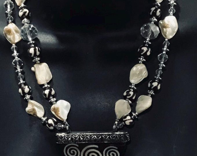 Bone pendant with crystals