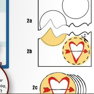 May include: A step-by-step guide on how to make a heart-shaped paper craft. The instructions show how to cut out the shapes and assemble them. The final product is a heart with an arrow through it.