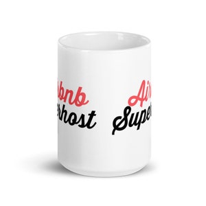 May include: White ceramic mug with black text that reads "Airbnb Superhost" and red text that reads "Air Super".
