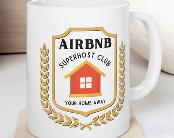 May include: White ceramic mug with a gold and red logo that says "Airbnb Superhost Club" and "Your Home Away".