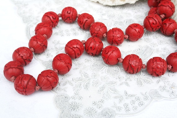 Vintage carved cinnabar bead necklace. Tomato red