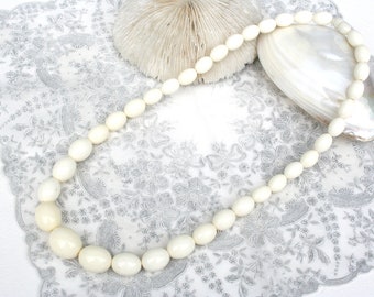 Vintage oval graduated bead necklace. Retro necklace, 1960s, graduated, large beads, 22 inches, opaque milky white plastic, hidden clasp
