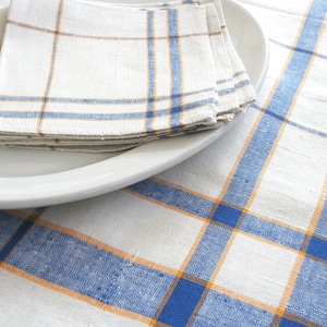 Linen table cloth and four napkins. NOS, table linen set, tablecloth, white, blue, yellow, farmhouse, simple, linear, plaid, stripes.