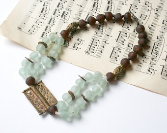 Bohemian glass and metal bead necklace. Beaded necklace, tribal necklace, glass, brass, metal, cast glass, pale aqua glass, brown, recycled