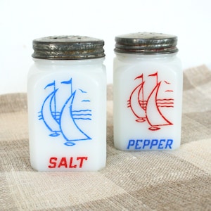 Vintage milk glass salt and pepper shakers. Hazel Atlas milk glass, square shaker, sailboat shaker, seagulls, red, blue, metal screw top