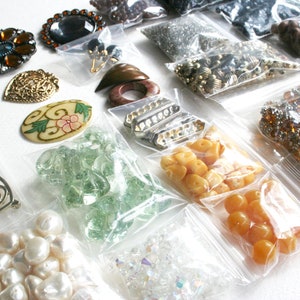 6 Bundle of jewelry making supplies, supply lot, destash. Beads, findings, glass, plastic, shell, brown, yellow, one and half pounds
