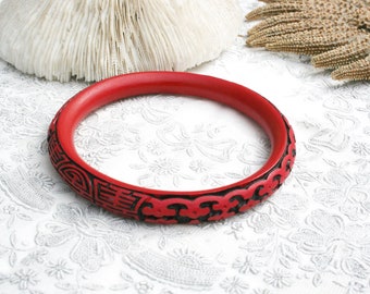 Vintage carved faux cinnabar bangle bracelet, brick red, black, Chinese, Asian, ornate, detailed, geometric, floral, ethnic, easy to wear