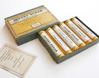 Medical supply packaging. Inverted sugar packaging only, vintage graphics, collectible, yellow, black, white, green, made in USA, Eli Lilly