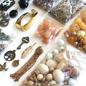 20 Bundle of jewelry making supplies, supply lot, destash. Beads, findings, glass, plastic, shell, brown, yellow, one and half pounds