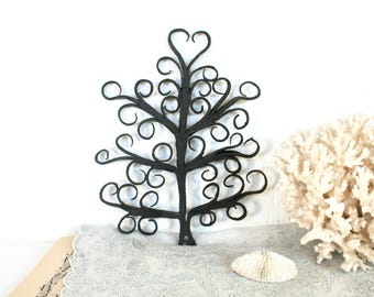 Vintage forged metal tree of life. Scroll trivet wall hanging, detailed, retro