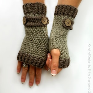 May include: A pair of fingerless gloves in brown and green, featuring decorative buttons. The gloves are crocheted and have a textured pattern.