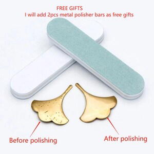 May include: Two brass ginkgo leaf shapes, one with a rough, unpolished surface and the other with a smooth, polished surface. The image shows the effect of polishing metal.